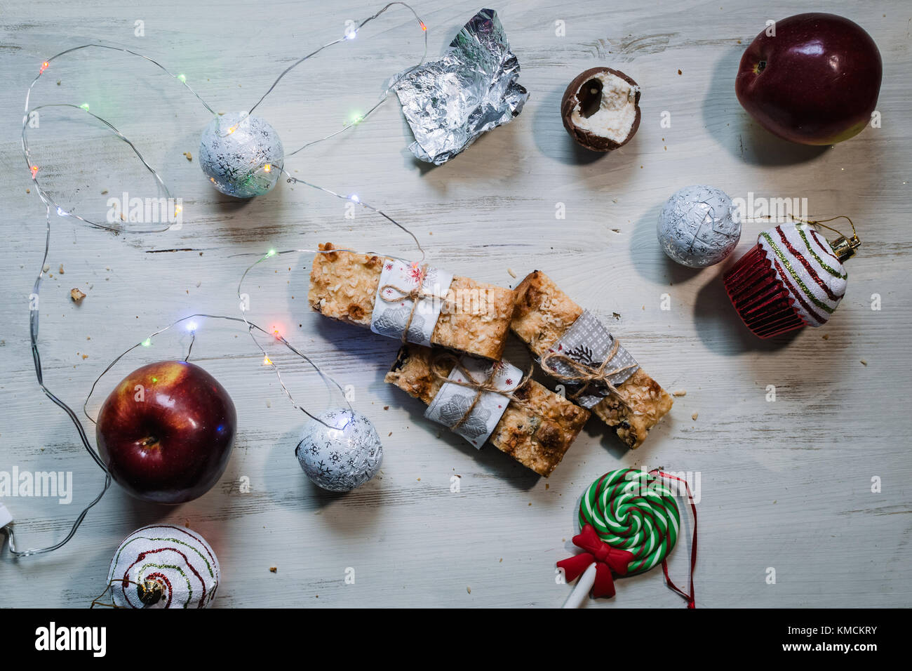 Christmas cookies, red apples, and lights Stock Photo