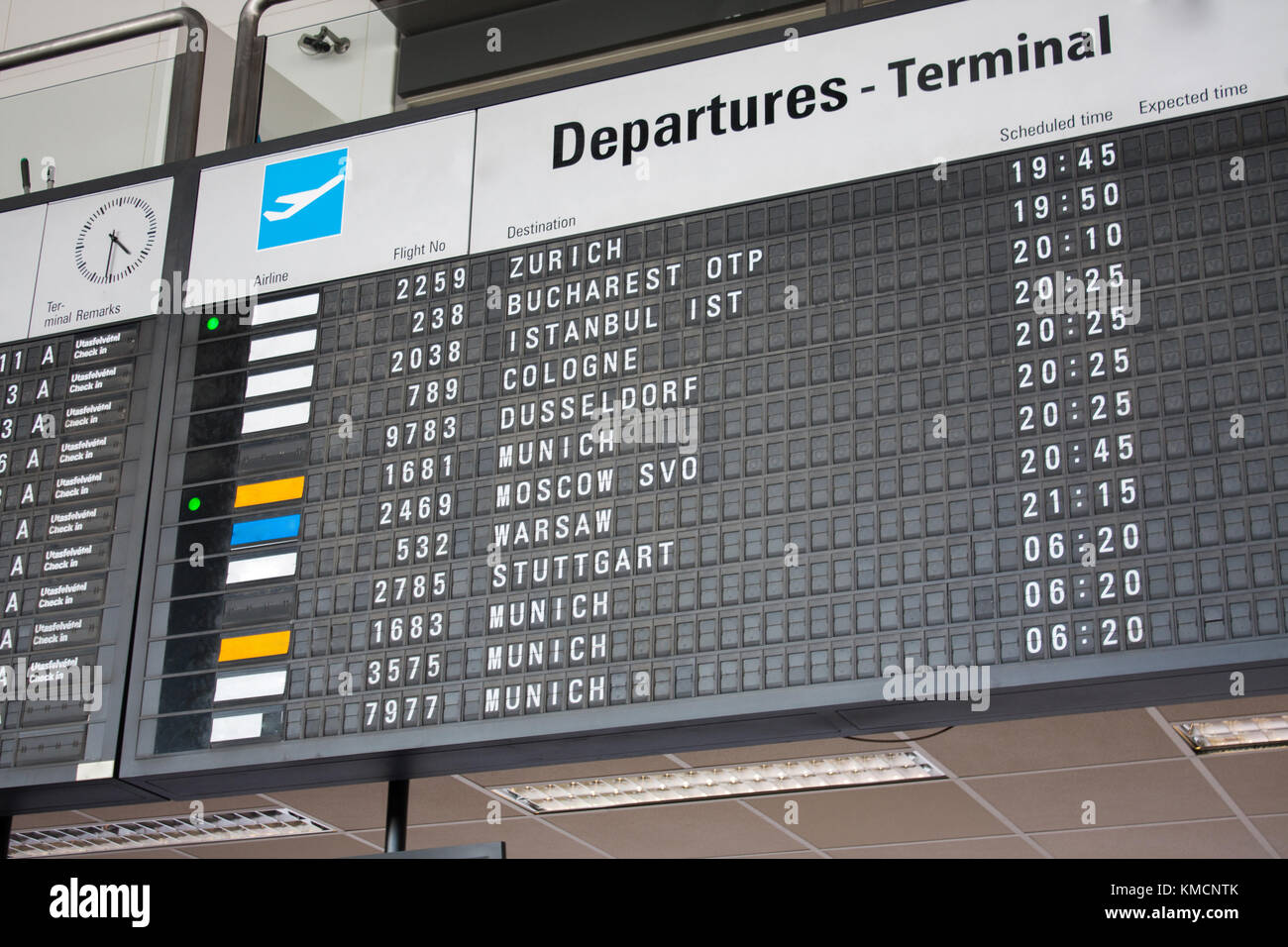 Flight Information Board at the International Airport, departure terminal timetable. Stock Photo