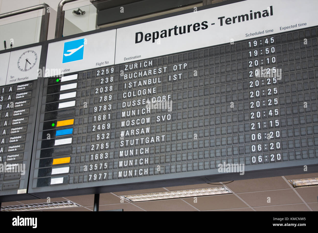 Flight Information Board at the International Airport, departure terminal timetable. Stock Photo