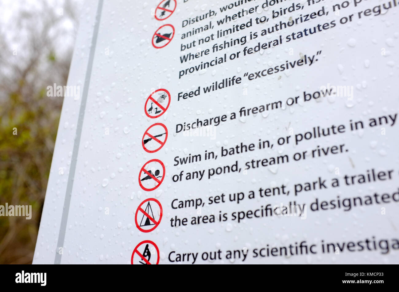 A list of prohibited activities and items at the entrance to a park in