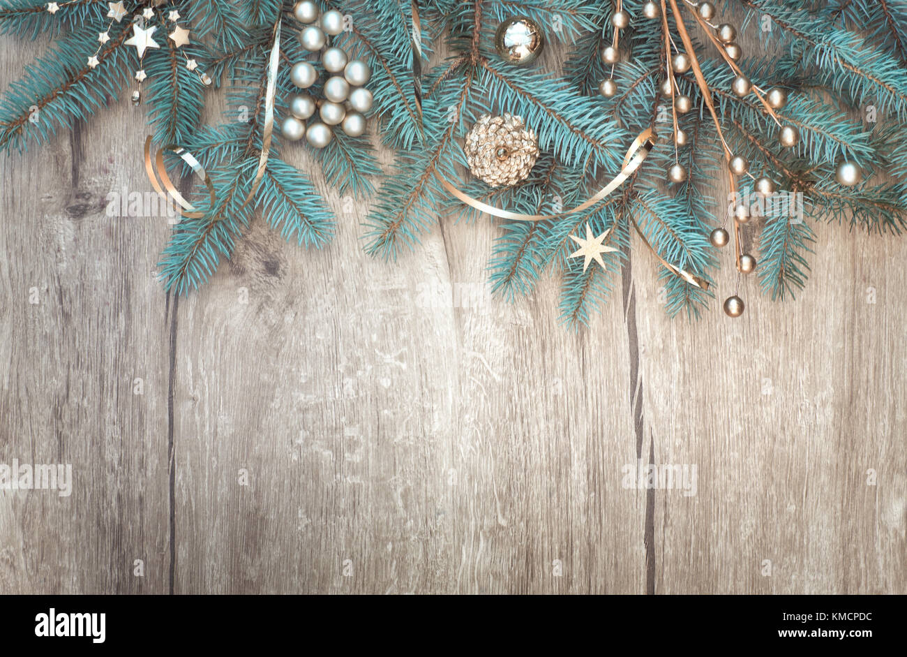 Christmas background with decorated fir tree branch border on wood. Top ...