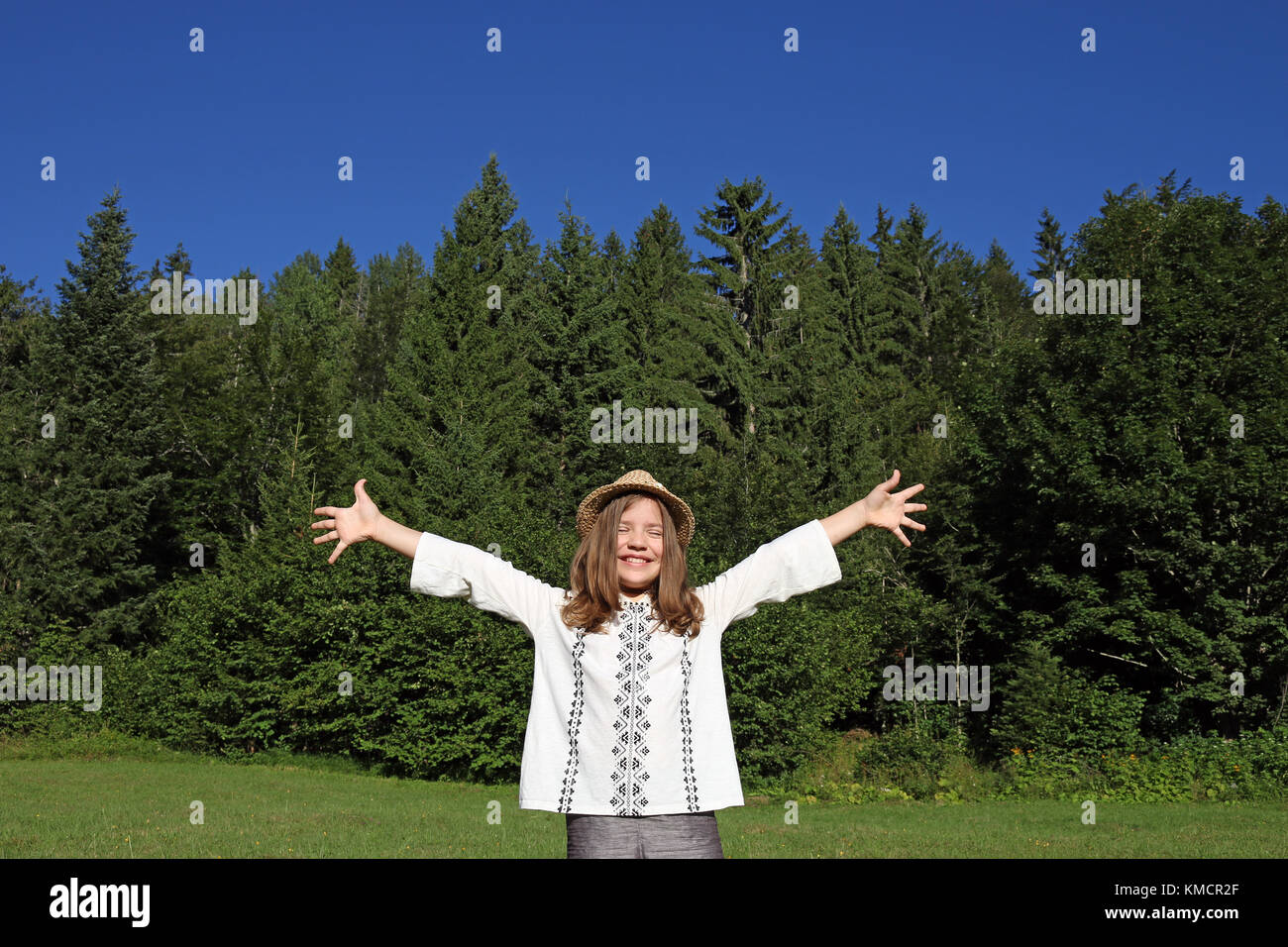 cheerful little girl with hands up enjoy in nature Stock Photo - Alamy