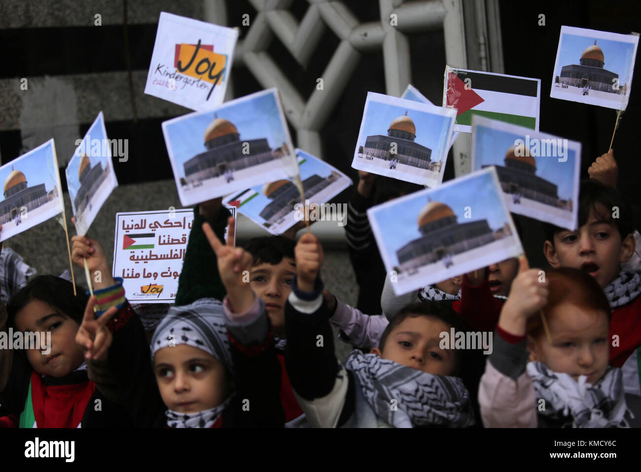 Gaza City, Gaza Strip, Palestinian Territory. 6th Dec, 2017. Palestinian children hold Palestine flags and pictures of Jerusalem during a protest in Gaza city, on December 6, 2017. U.S. officials say President Donald Trump will recognize Jerusalem as Israel's capital Wednesday, Dec. 6, and instruct the State Department to begin the multi-year process of moving the American embassy from Tel Aviv to the holy city. His decision could have deep repercussions across the region Credit: Ashraf Amra/APA Images/ZUMA Wire/Alamy Live News Stock Photo