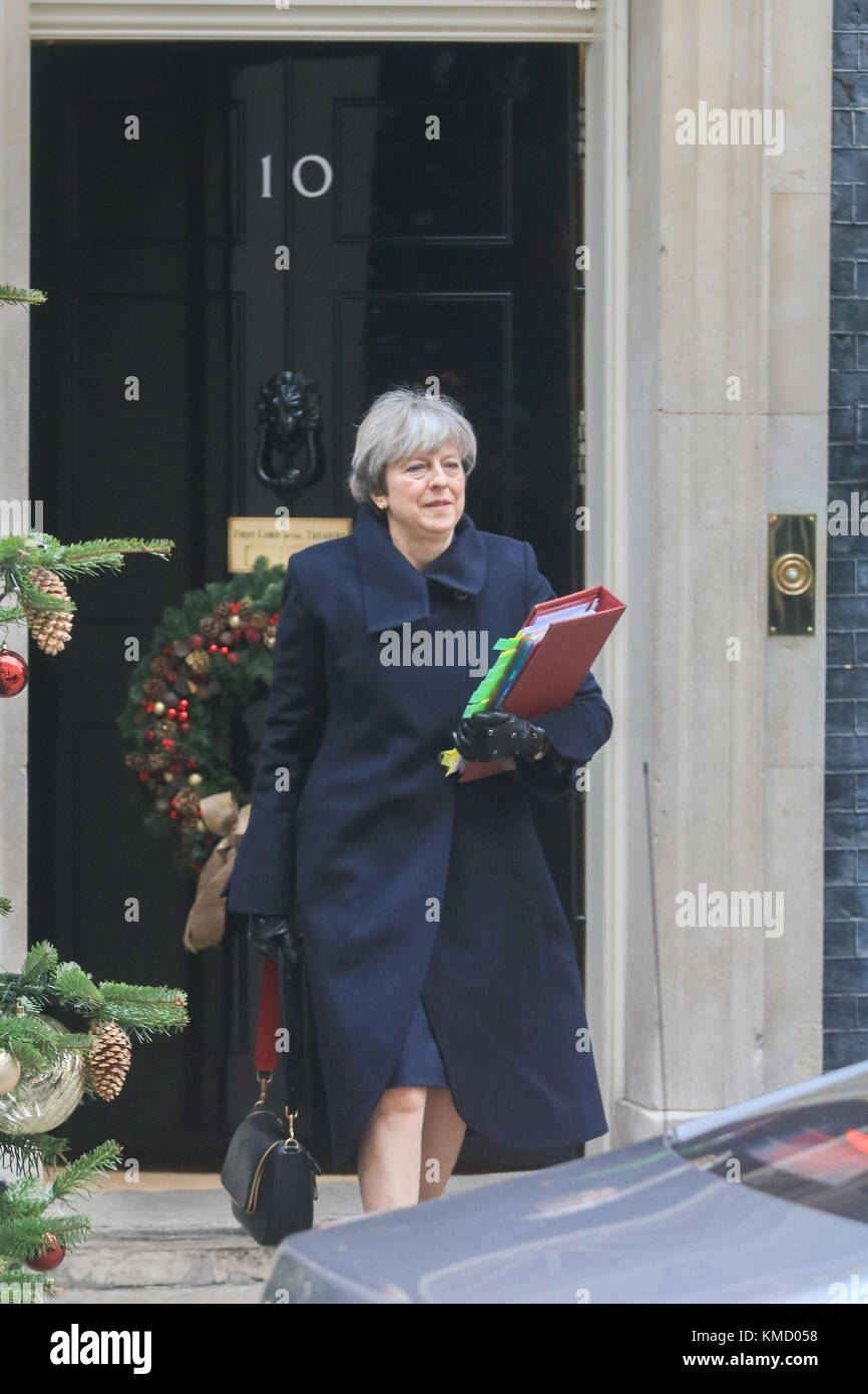 London UK. 6th December 2017. British Prime Minister Theresa May departs No 10 Downing Street  for prime minister’s questions at the House of Commons. Two men were arrested last week have been charged with terrorism offences involving planning to bomb Downing Street security gates and then attack Mrs Theresa May with a knife and a suicide vest . Credit: amer ghazzal/Alamy Live News Stock Photo