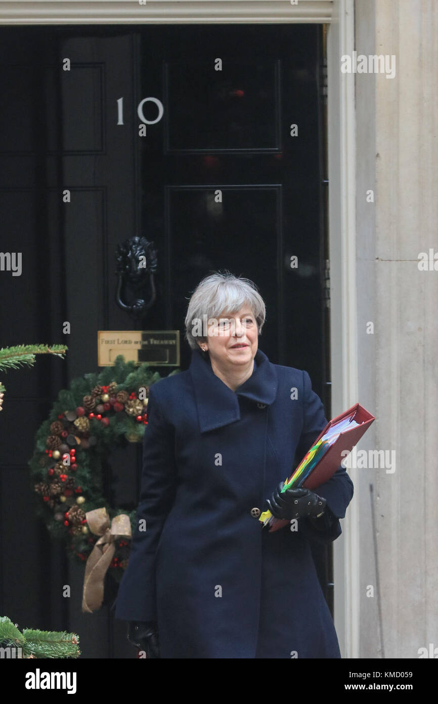 London UK. 6th December 2017. British Prime Minister Theresa May departs No 10 Downing Street  for prime minister’s questions at the House of Commons. Two men were arrested last week have been charged with terrorism offences involving planning to bomb Downing Street security gates and then attack Mrs Theresa May with a knife and a suicide vest . Credit: amer ghazzal/Alamy Live News Stock Photo