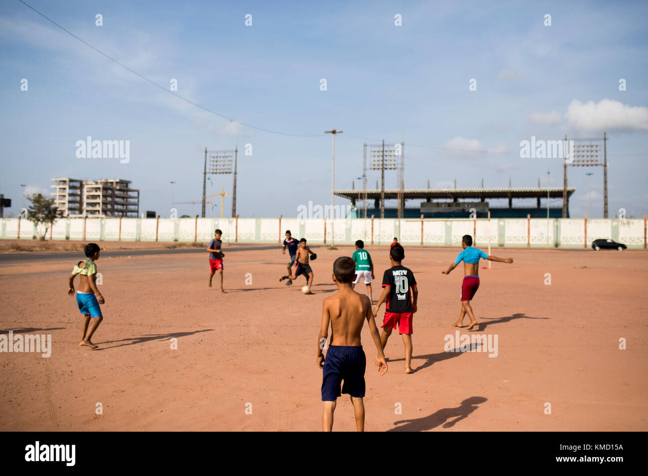 Macapa, Brazil. 17th Nov, 2017. Children play football on a field directly behind the equator in Macapa, Brazil, 17 November 2017. Measurements show that the equator draws through the Zerao soccer stadium without touching the centre line. Credit: Autumn Sonnichsen/dpa/Alamy Live News Stock Photo