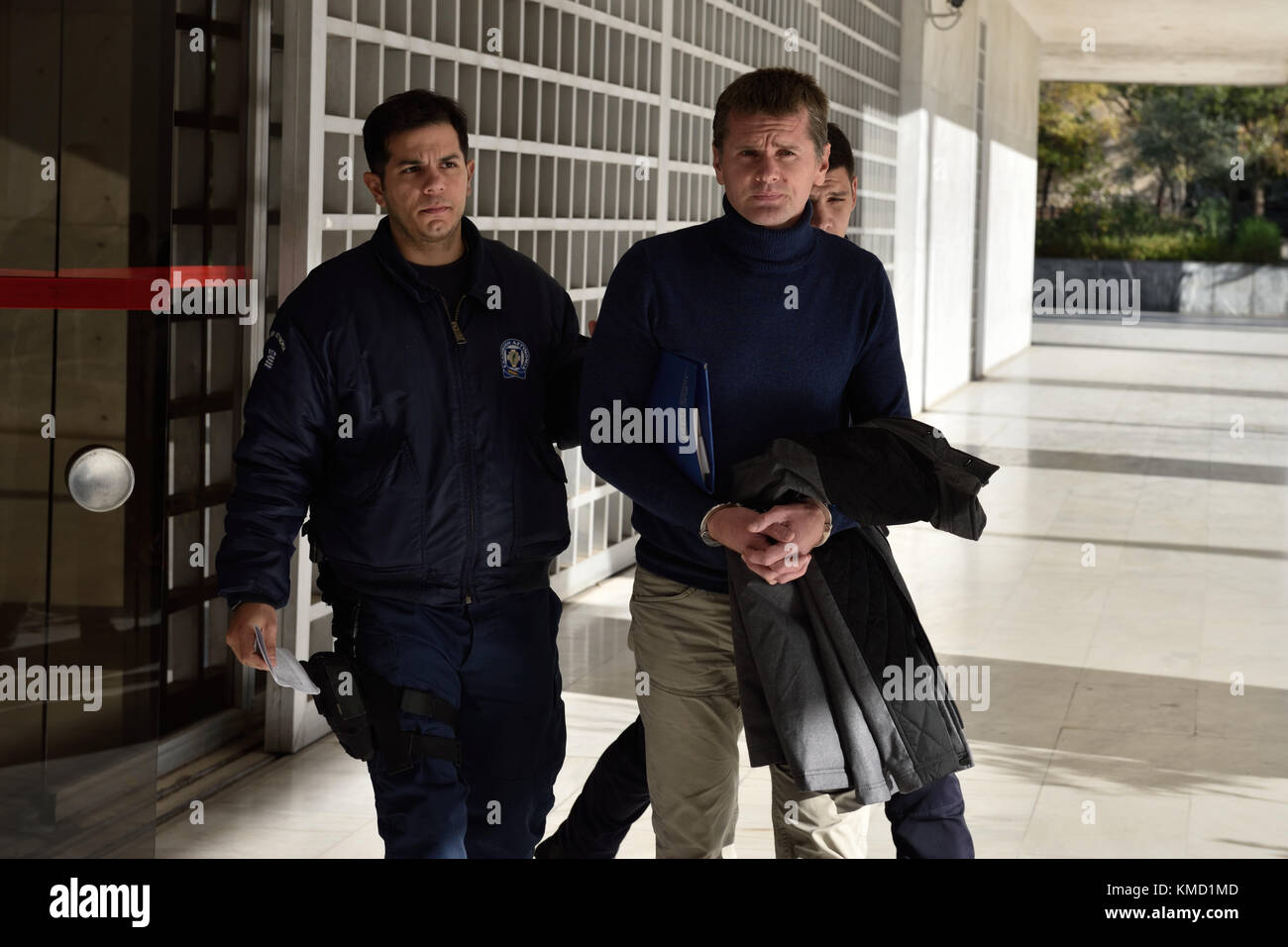 Athens, Greece, 6th Dec. 2017. Police officers escort Russian bitcoin fraud suspect Alexander Vinnik as he leaves Supreme Court following a hearing of his appeal against extradition to the US in Athens, Greece. Credit: Nicolas Koutsokostas/Alamy Live News Stock Photo