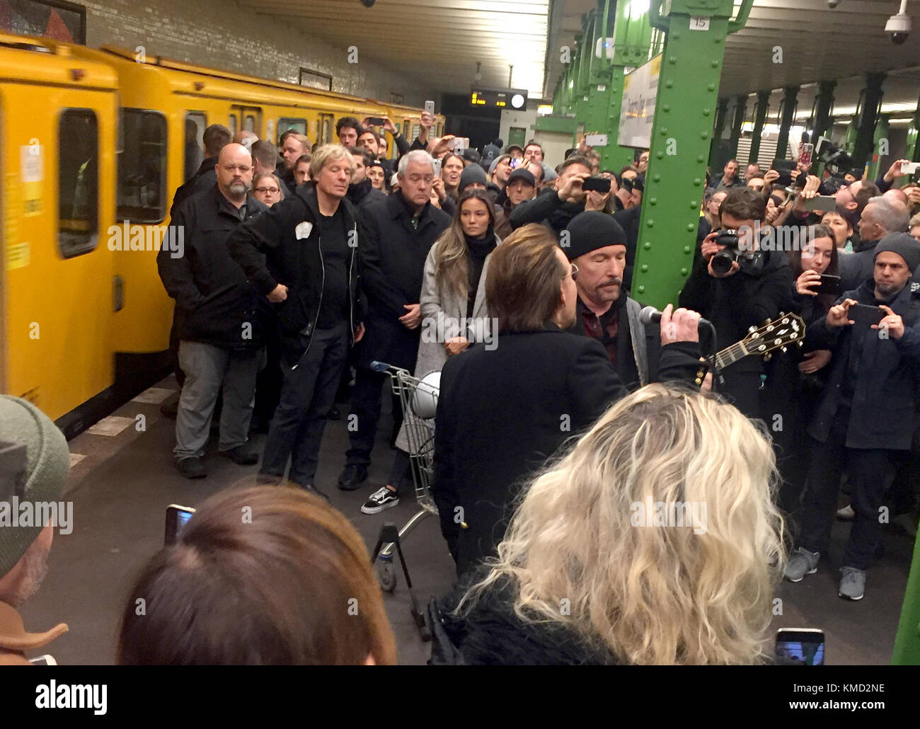 Berlin, Germany. 06th Dec, 2017. HANDOUT - The handout made available shows singer Bono (C, front) and guitar player David Howell Evans 'The Edge' (C, back) of the band U2 standing n an underground platform of the U2 line in Berlin, Germany, 06 December 2017. The band performed a concert at the underground station. (ATTENTION EDITORS: FOR EDITORIAL USE ONLY IN CONNECTION WITH CURRENT REPORTING/ MANDATORY CREDIT) Credit: Anja Caspary/Radioeins/dpa/Alamy Live News Stock Photo