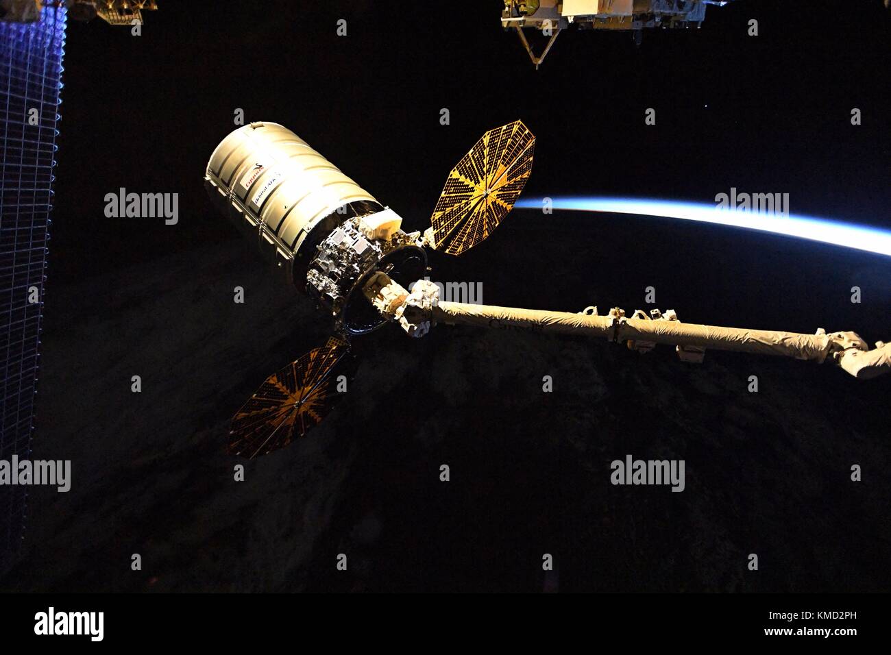 The Orbital ATK Cygnus cargo spacecraft is released by the Canada Arm 2 from the International Space Station December 6, 2017 in Earth Orbit. Cygnus will deployed 14 CubeSats from the NanoRacks deployer and will later be burned up on destructive reentry in the Earth atmosphere. Stock Photo