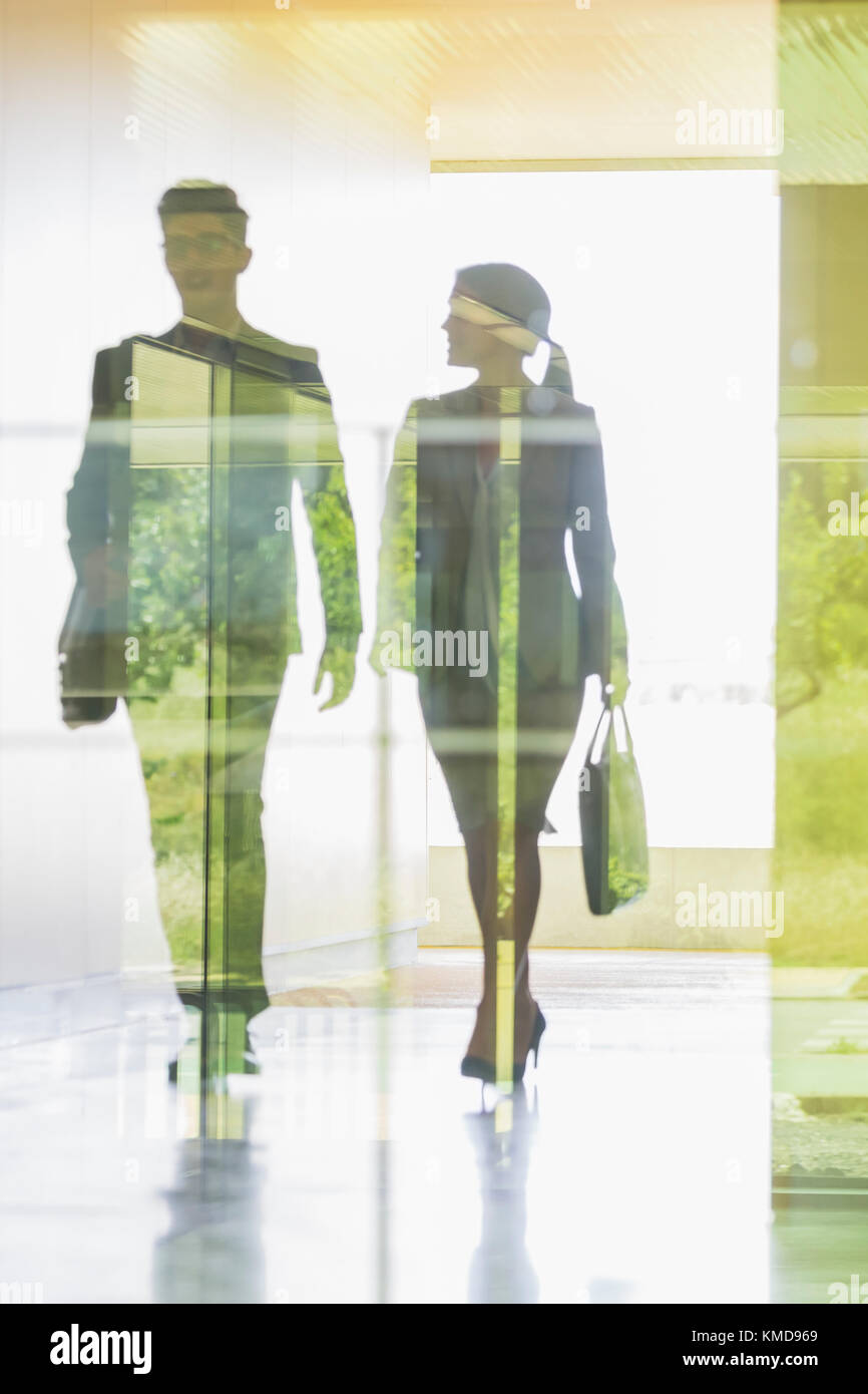 Silhouette business people walking in office corridor Stock Photo - Alamy