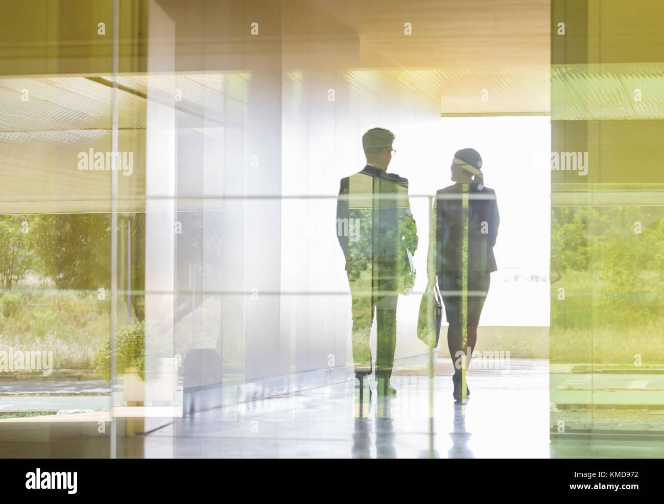 Silhouette business people walking in modern office corridor Stock ...