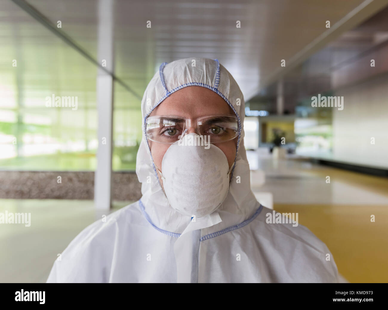 Portrait serious scientist in clean suit Stock Photo