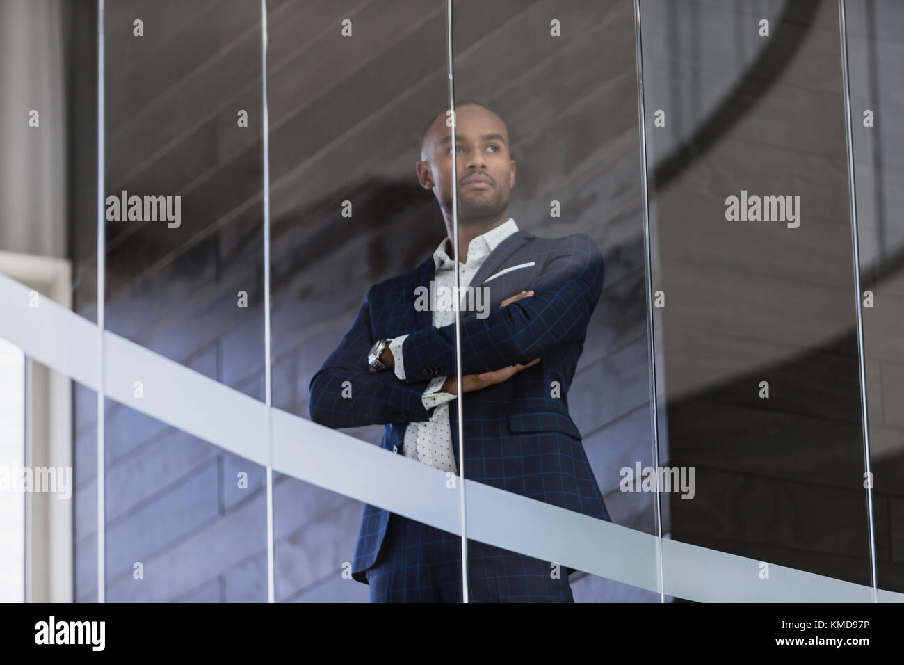Serious,CEO businessman standing at office window Stock Photo