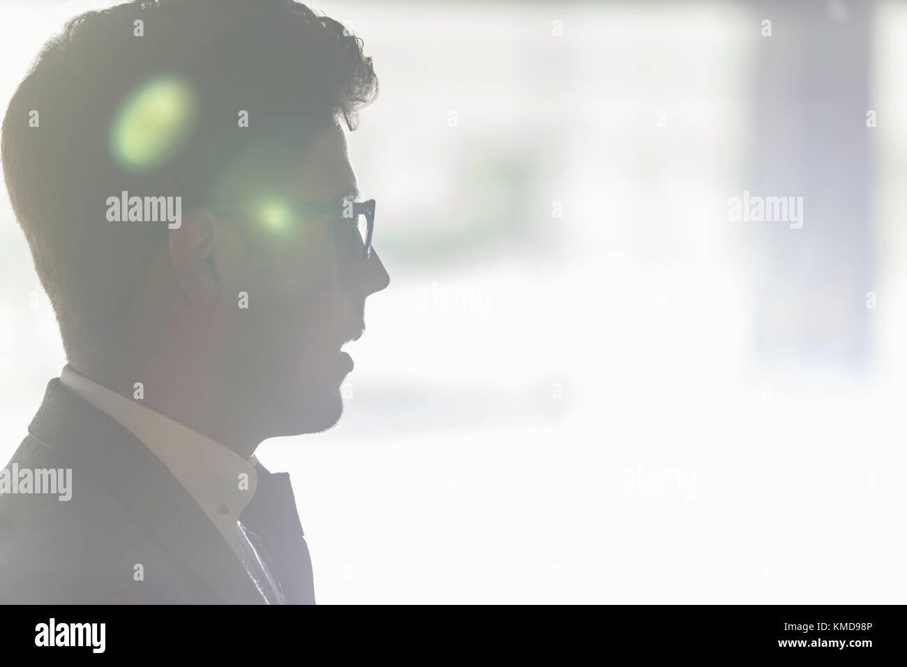 Silhouette profile businessman in eyeglasses looking away Stock Photo