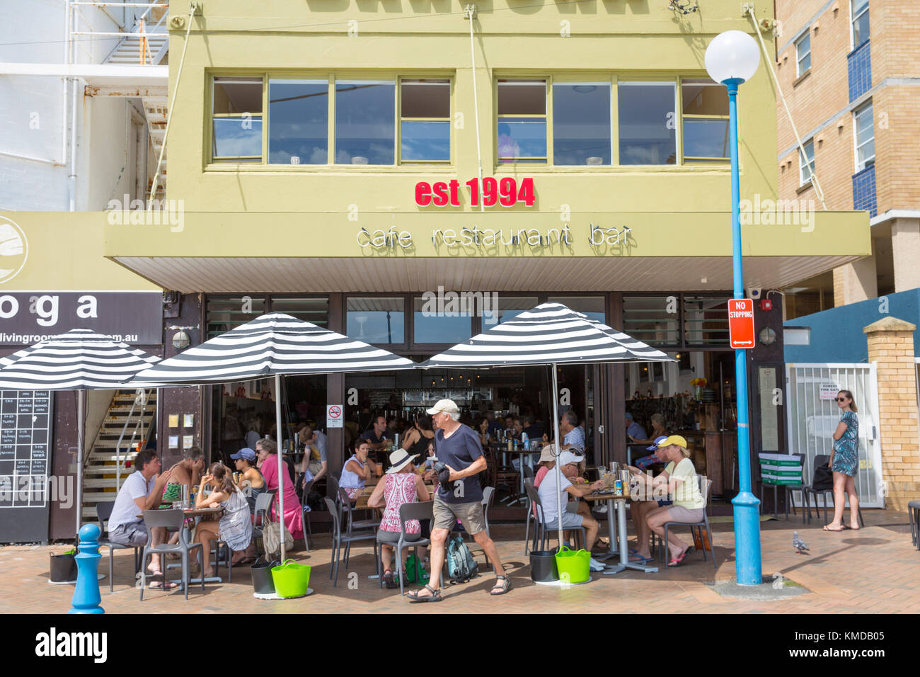 Cafe restaurant in Coogee beach Sydney with people enjoying coffee and breakfast outside Stock Photo