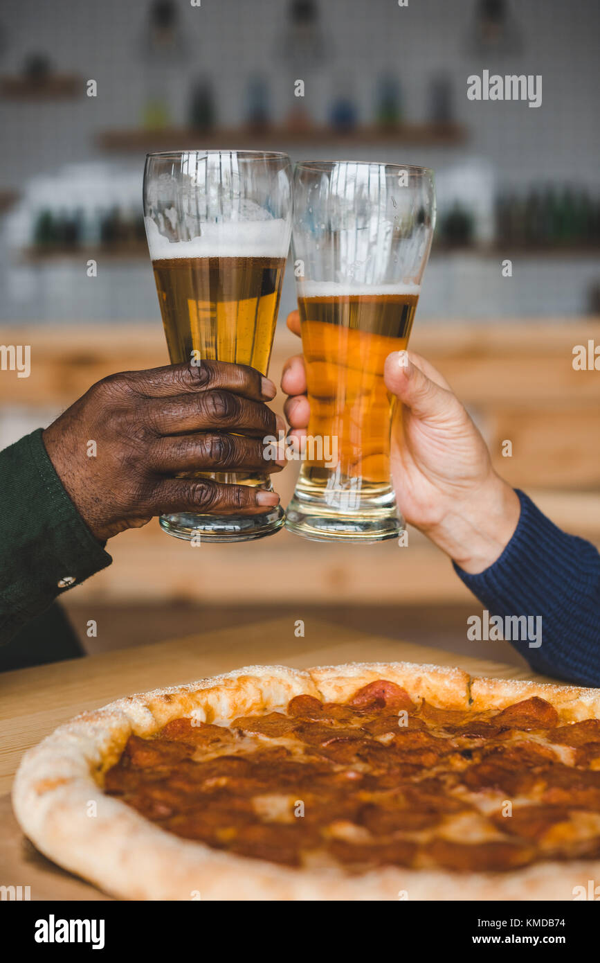 friends clinking glasses of beer Stock Photo Alamy