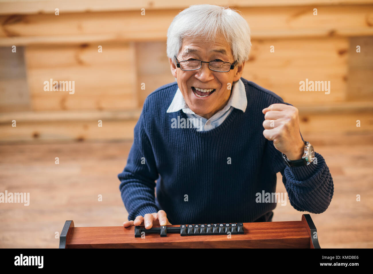asian man celebrating victory Stock Photo