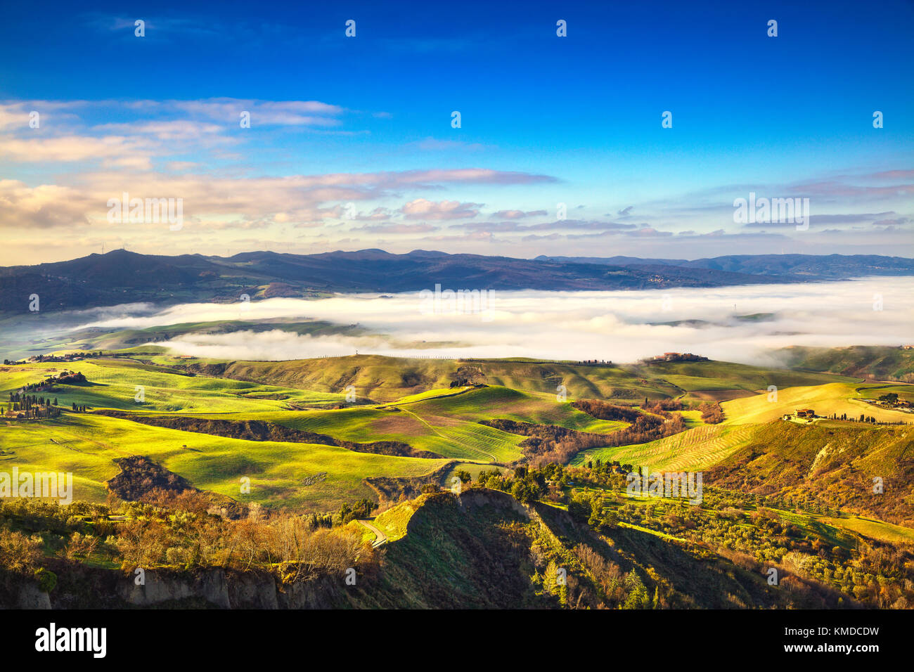 Balze of Volterra foggy morning panorama, farmlands and green fields ...