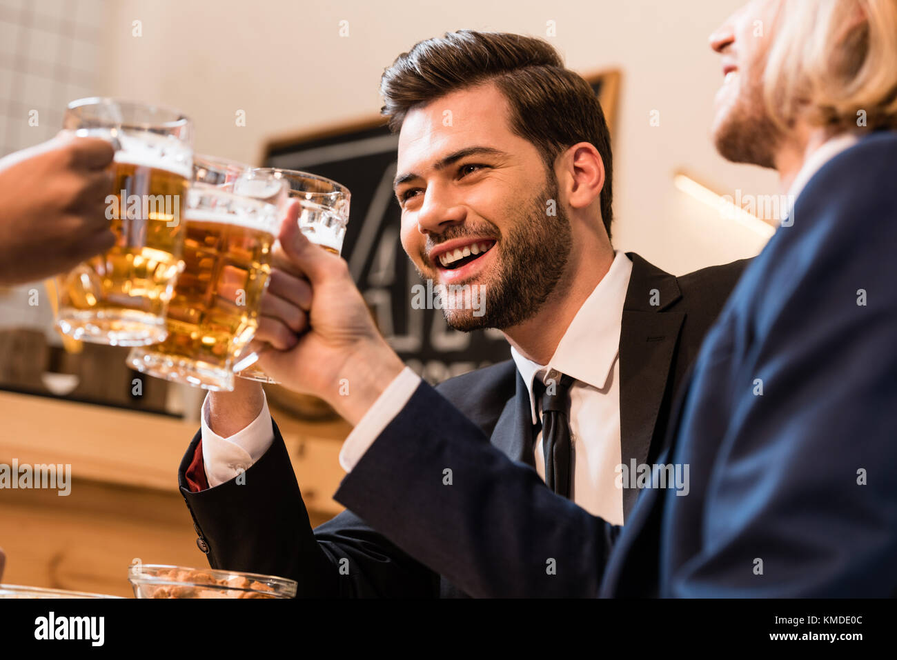 businessmen clinking beer glasses Stock Photo Alamy