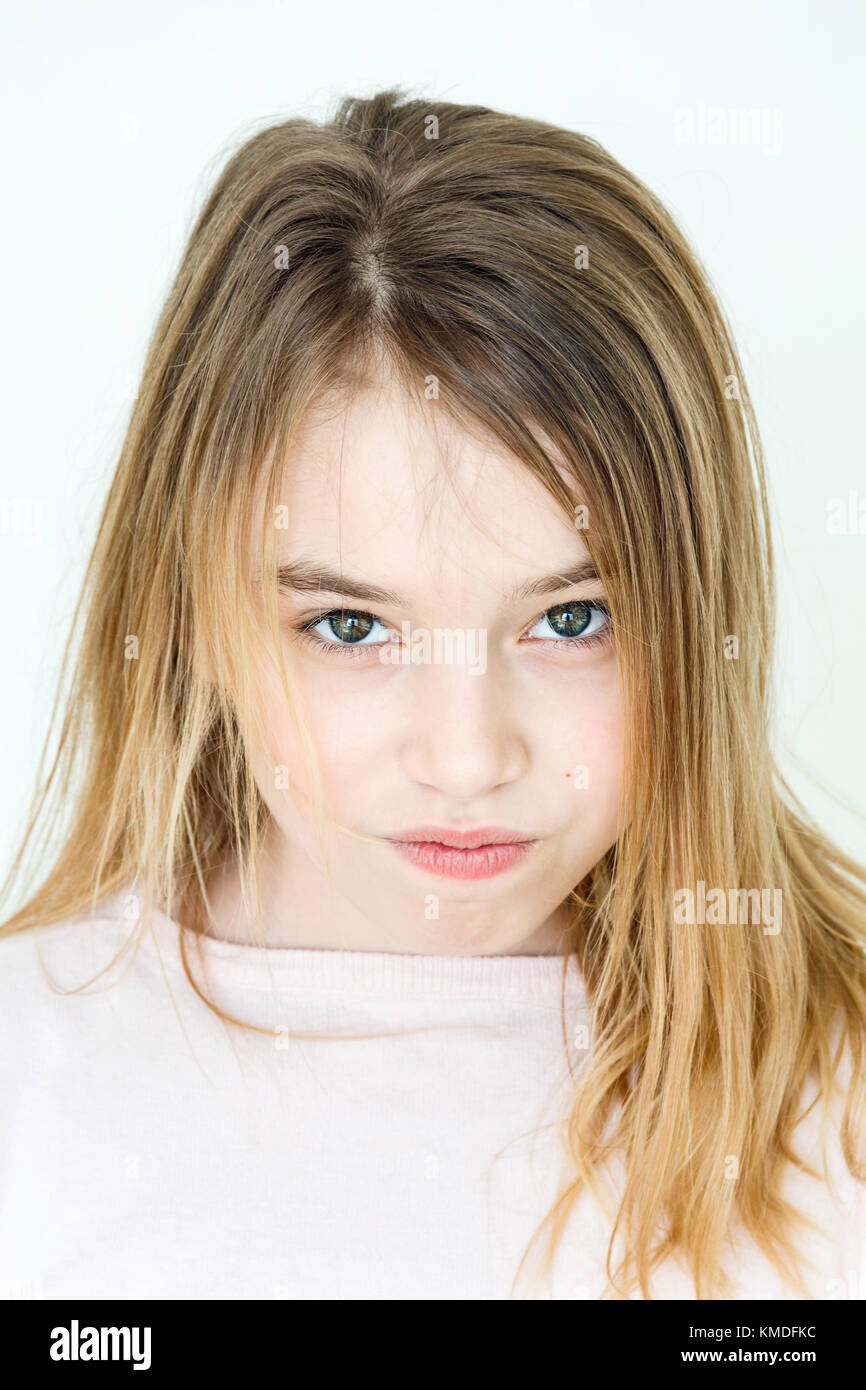 Cute girl eleven years old with blond long hair and green eyes Stock Photo  - Alamy