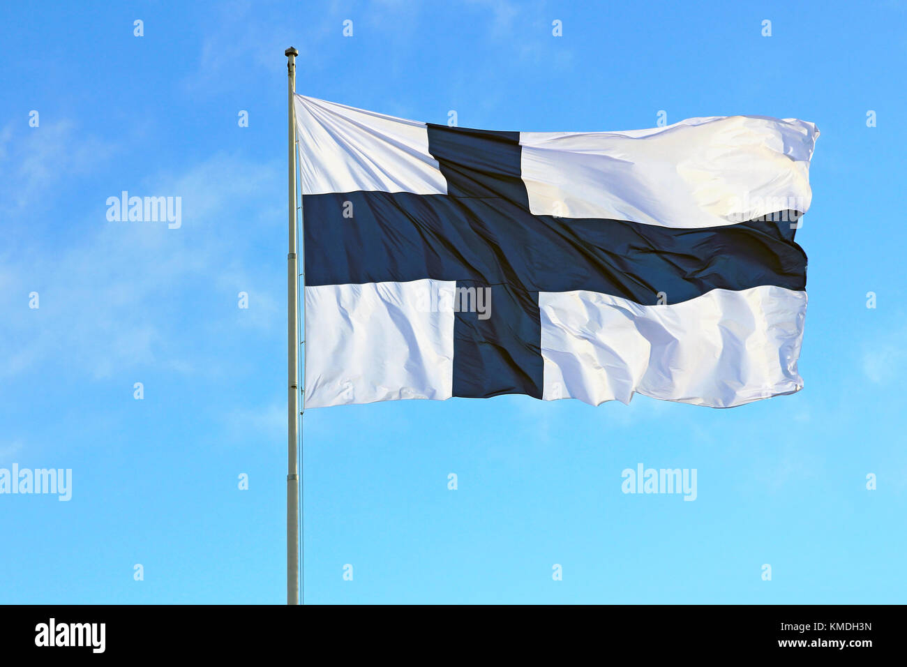National flag of Finland against clear blue sky on 6 December 2017. Stock Photo