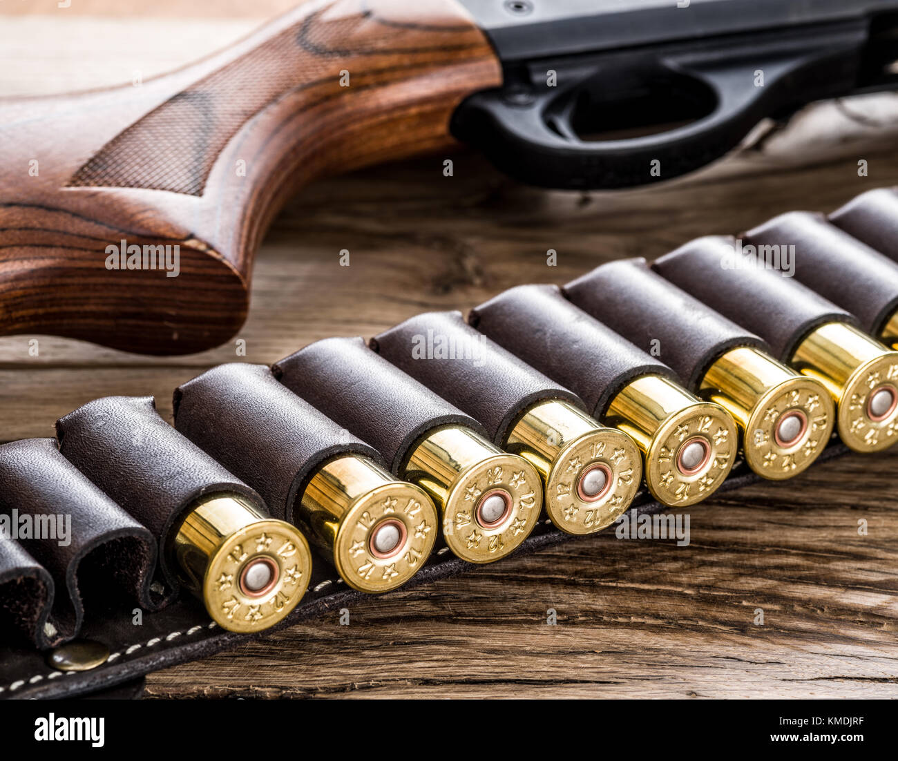 Pump action shotgun, 12 guage cartridge on the wooden table Stock Photo -  Alamy