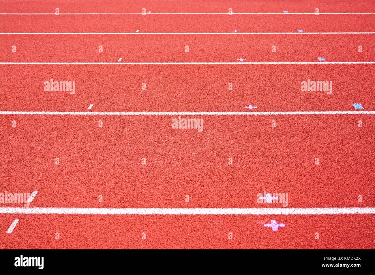 Red tracking field for running competition background texture. Stock Photo