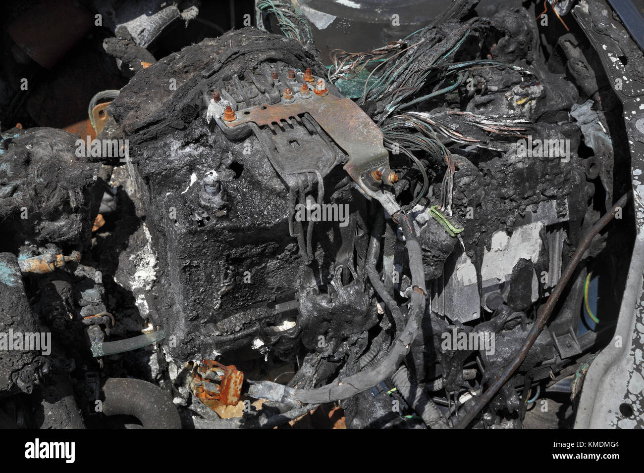 Burned and damaged car battery after fire accident Stock Photo - Alamy