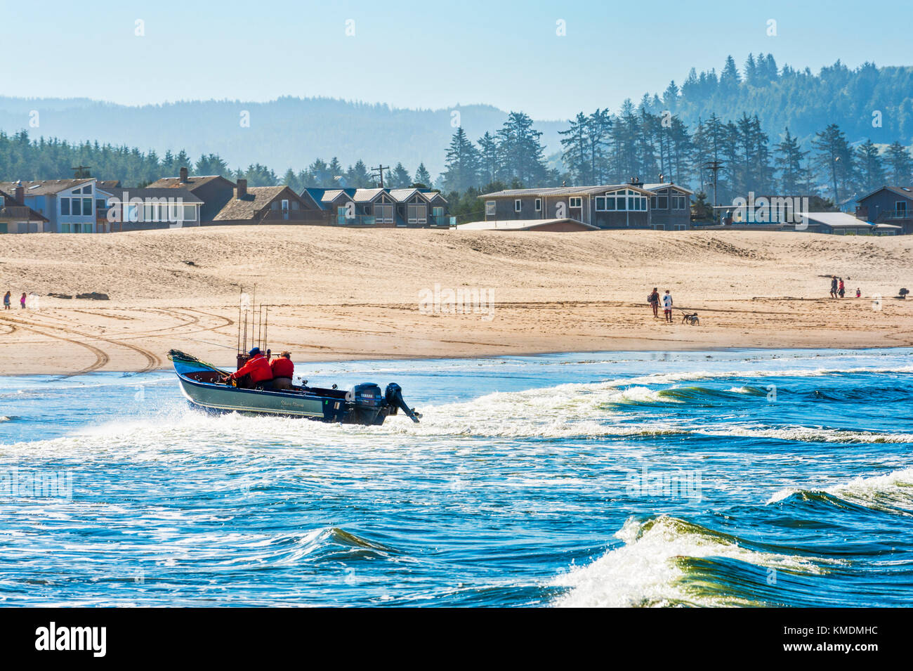 Pacific City, Oregon, USA - July 2, 2015: A dory boat lands on the beach at Cape Kiwanda, Pacific City, Oregon Stock Photo