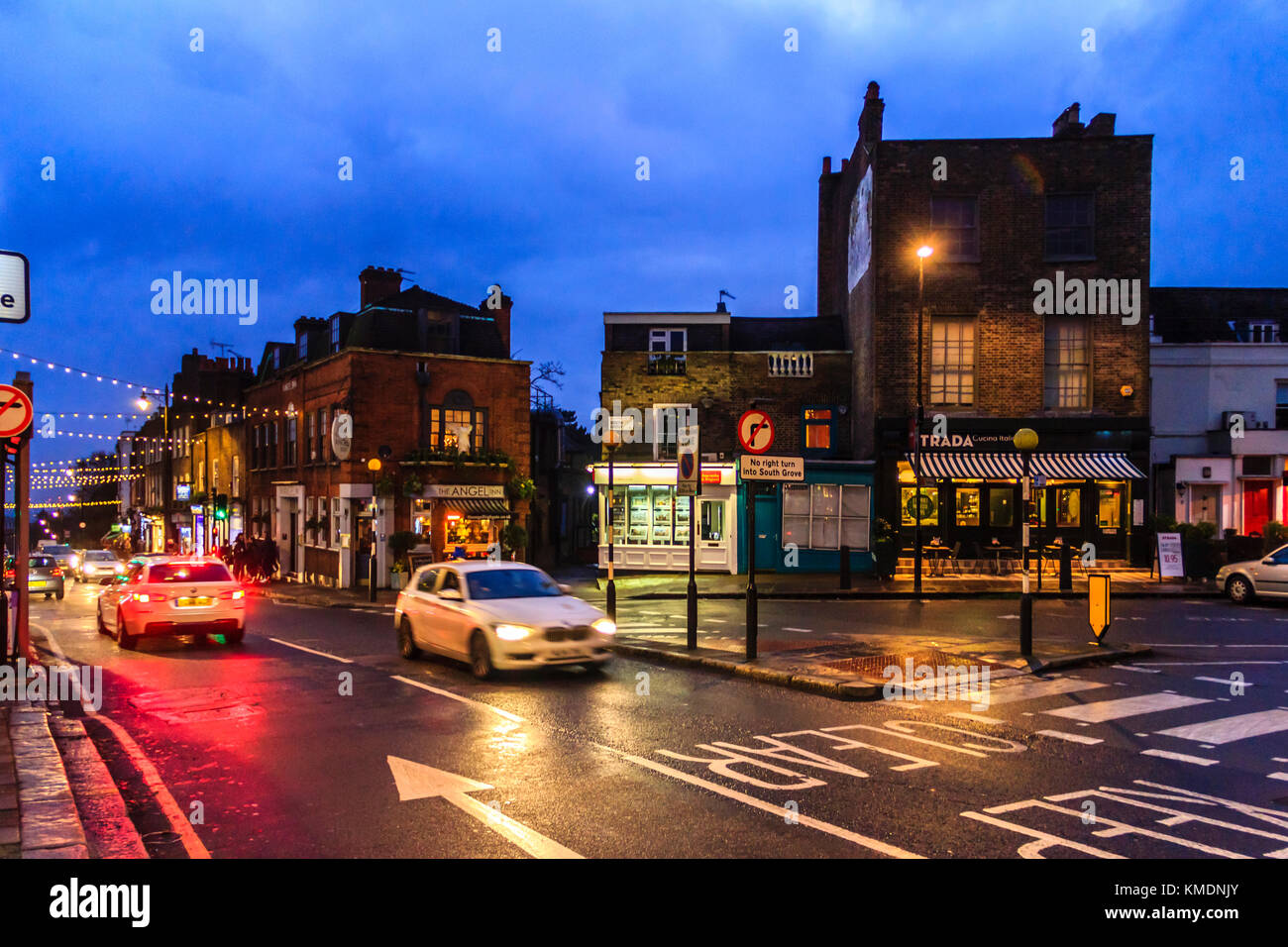 Blue and orange urban night scene in Highgate Village on a Sunday in December, London, UK Stock Photo
