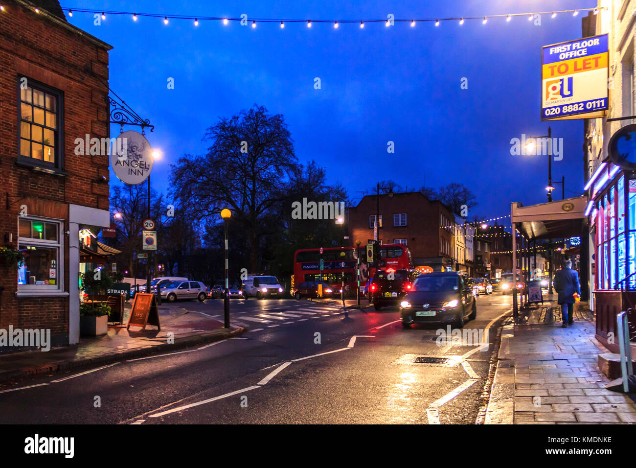Blue and orange urban night scene in Highgate Village on a Sunday in December, London, UK Stock Photo