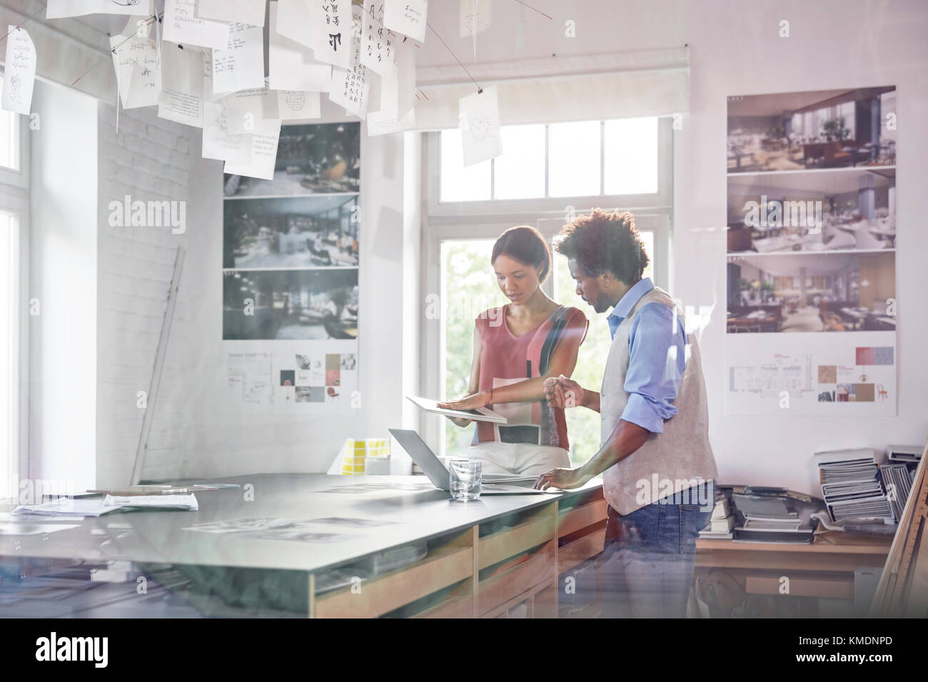 Design professionals using digital tablet,brainstorming in office Stock ...