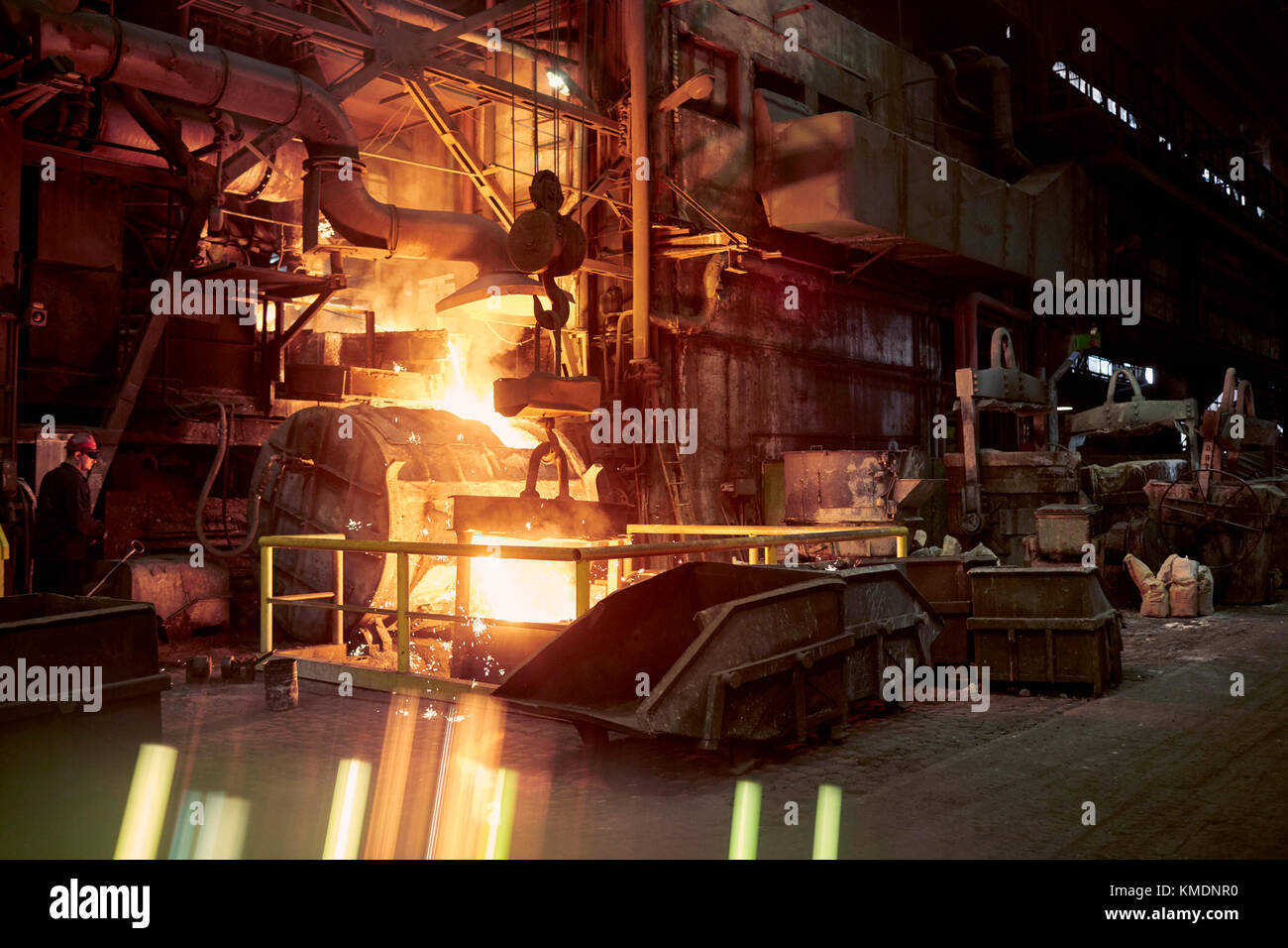 Molten furnace in dark steel mill Stock Photo