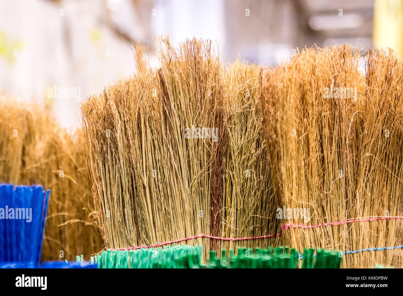 Close up straw brooms in market Stock Photo Alamy