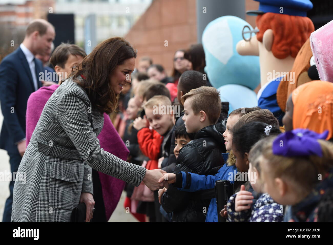 The Duchess of Cambridge greets well-wishers as she arrives for the Children's Global Media Summit at Manchester Central Convention Complex, which brings together creatives, technology innovators, policymakers, executives and thought leaders from around the globe to inform and redesign the future of media for this generation and explore the impact that digital technology will have in children&Otilde;s futures. Stock Photo