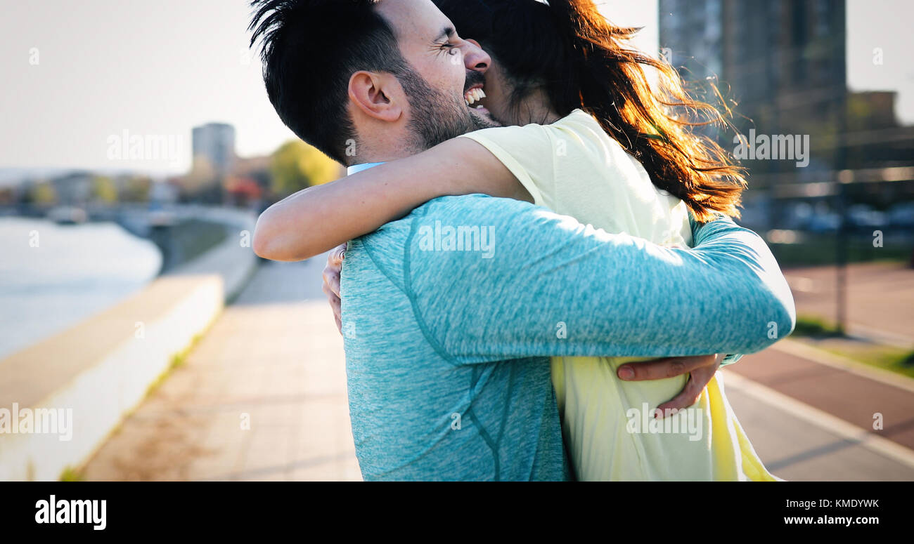 Happy young sporty couple sharing romantic moments Stock Photo - Alamy