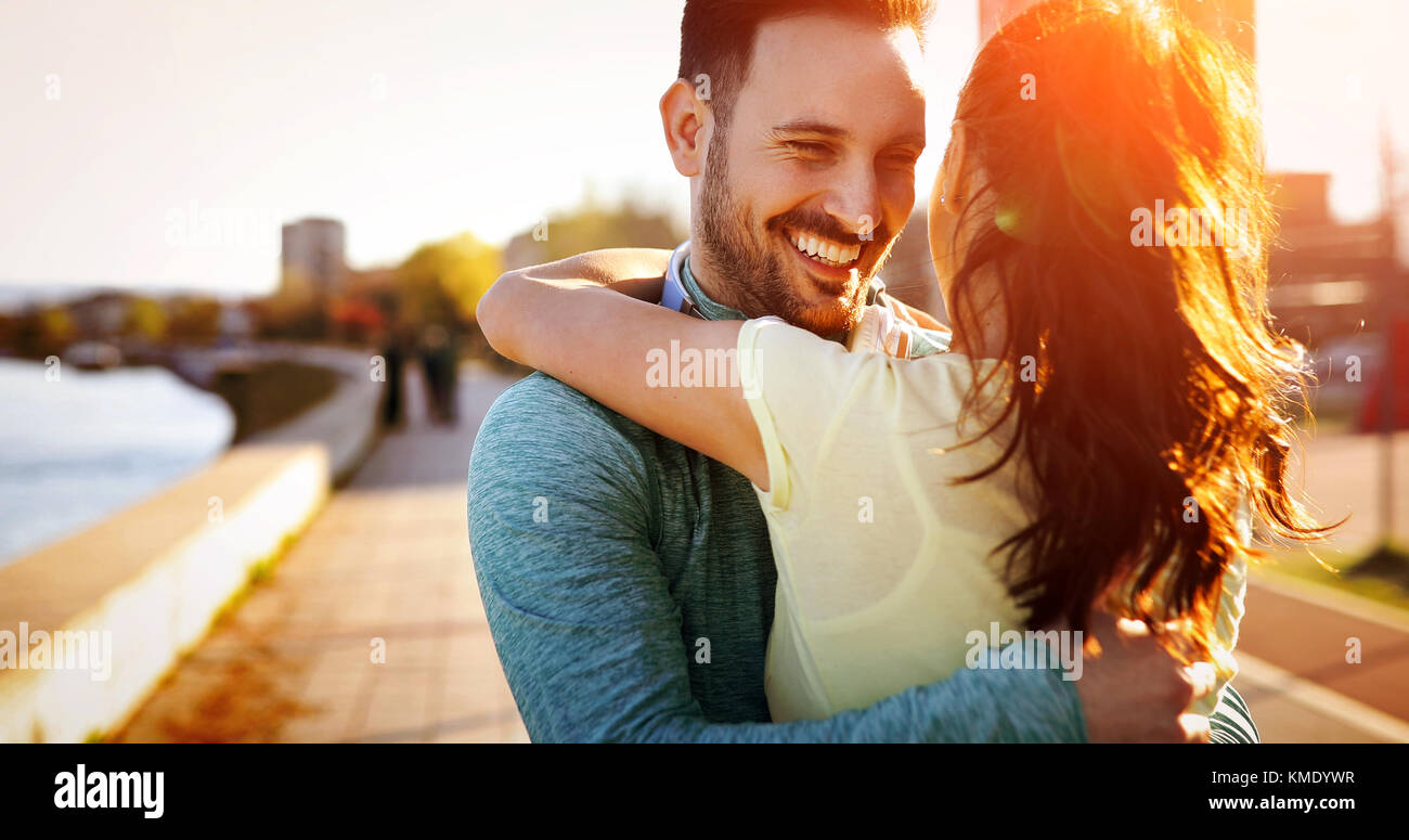 Happy young sporty couple sharing romantic moments Stock Photo - Alamy