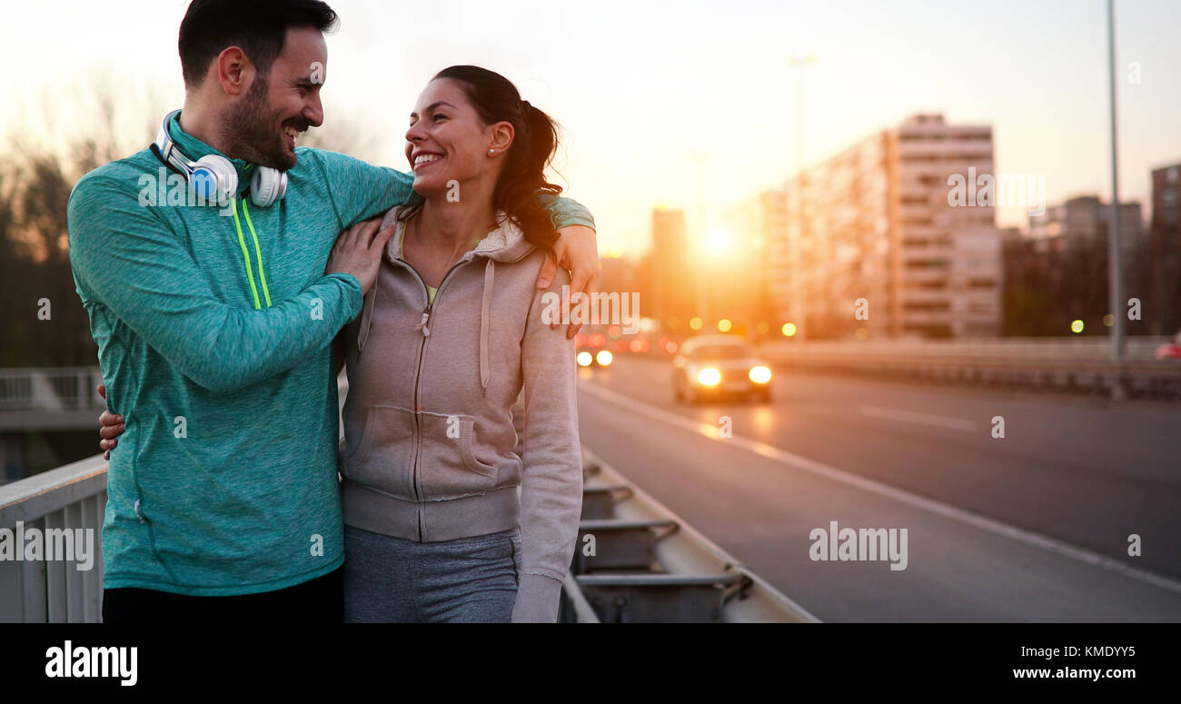 Happy young sporty couple sharing romantic moments Stock Photo - Alamy