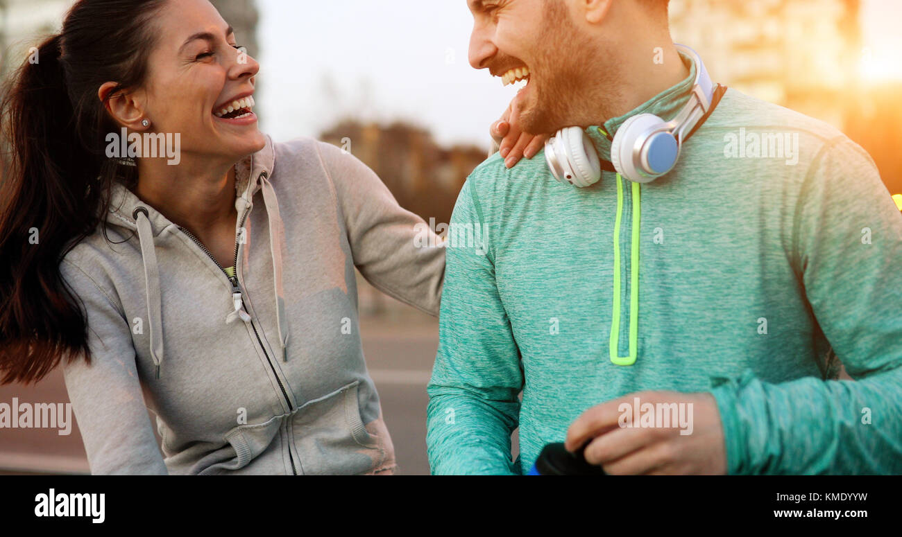 Happy young sporty couple sharing romantic moments Stock Photo - Alamy