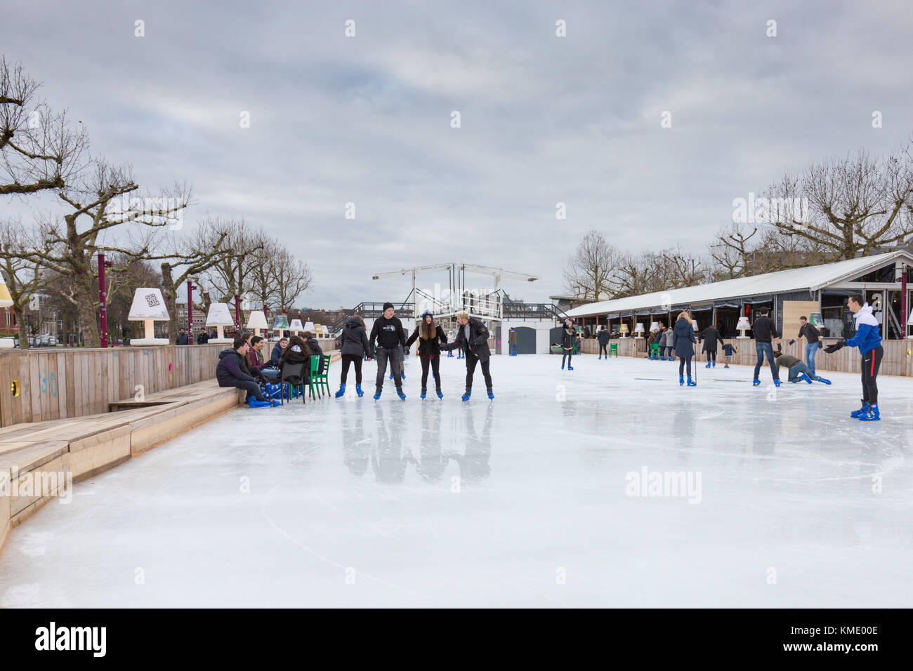People are skating on the ice rink at the Museumplein in Amsterdam, the Netherlands Stock Photo