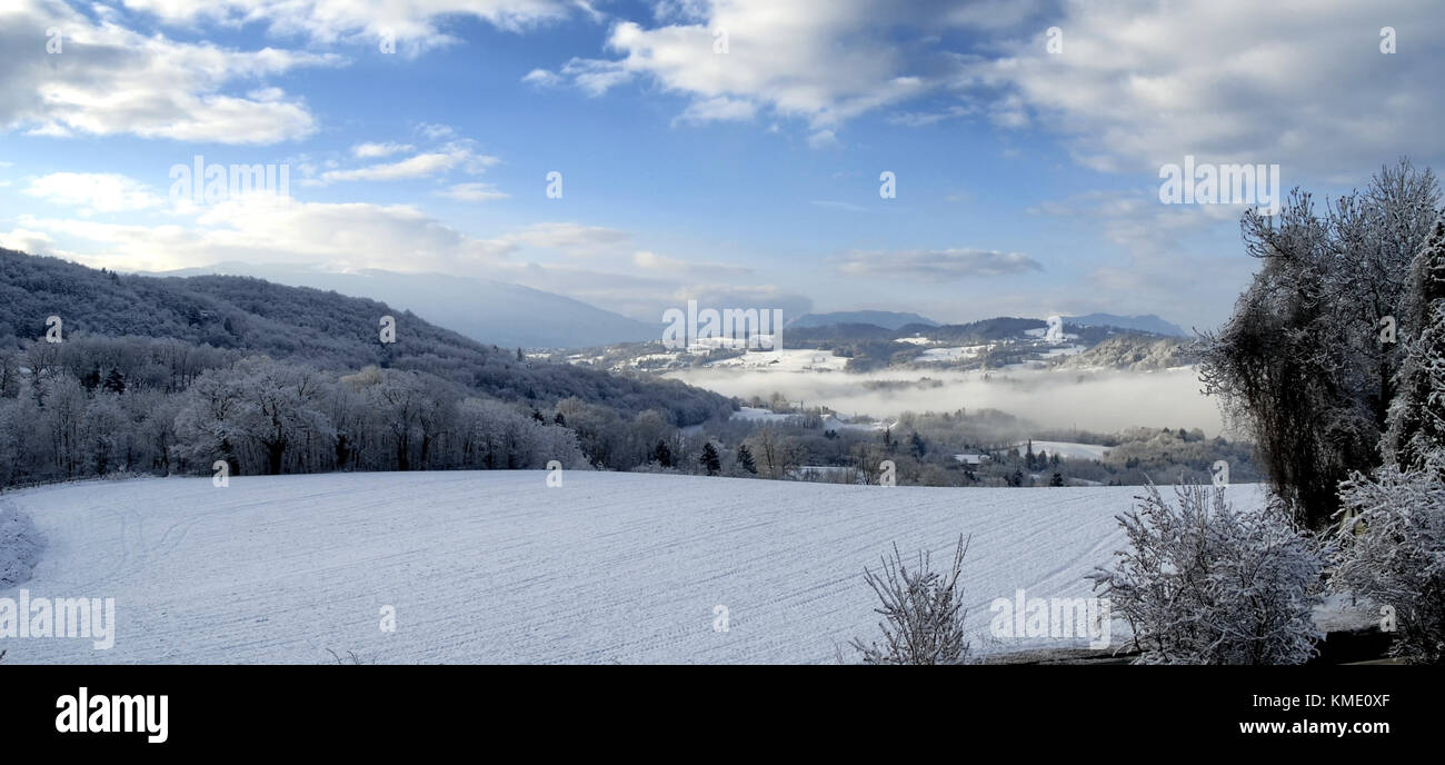 a winter landscape with snow, blue sky and clouds Stock Photo - Alamy