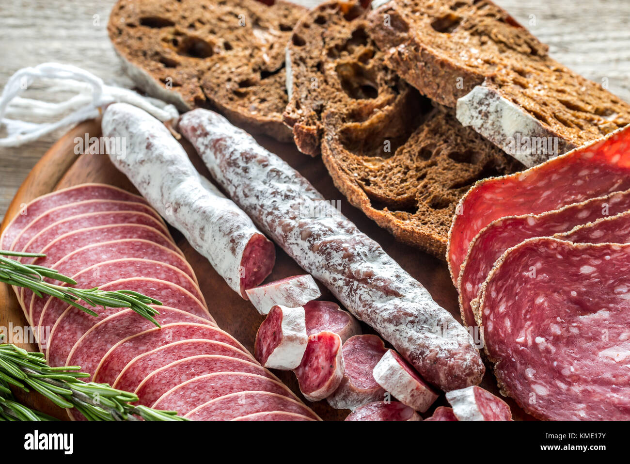 Different kinds of salami with darkrye bread Stock Photo Alamy