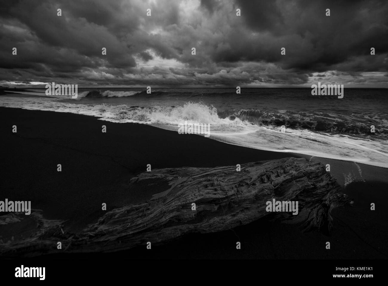 Waves rolling onto the beach during a storm Stock Photo - Alamy