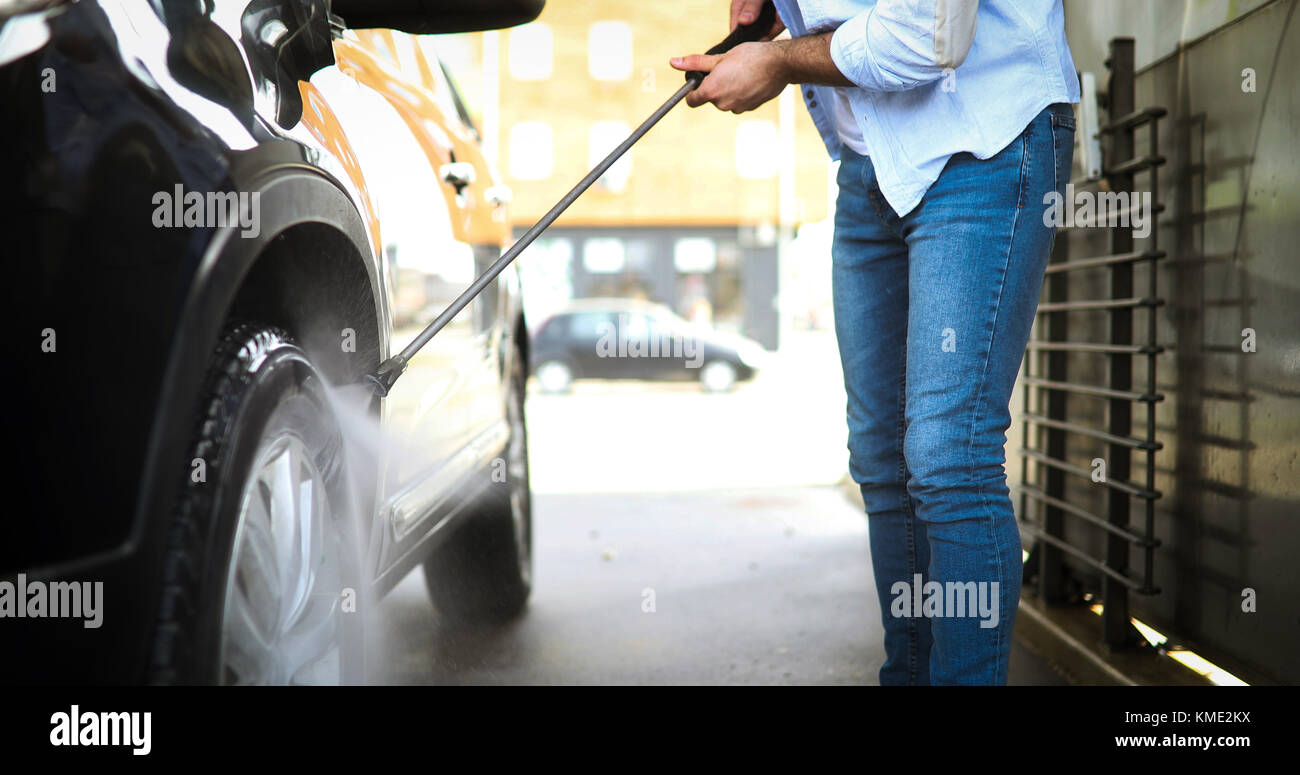 Manual car wash with pressurized water in car wash Stock Photo Alamy