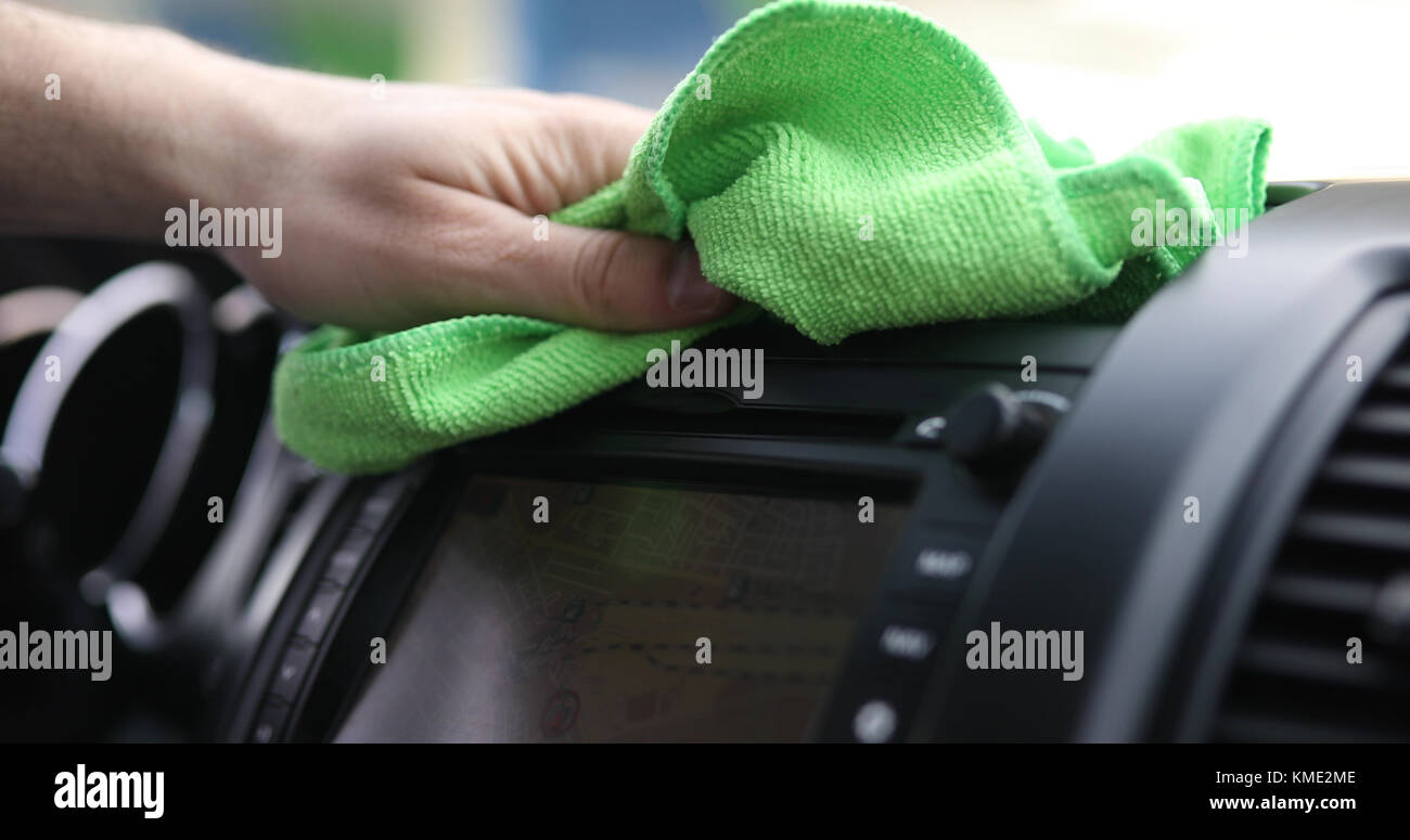 Hand cleaning car steering wheel with microfiber cloth Stock Photo Alamy