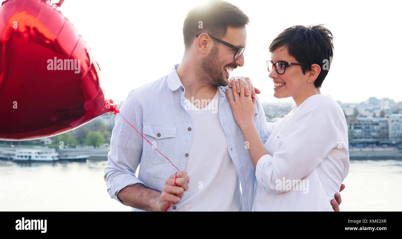 smiling couple in love with balloons on sunset Stock Photo - Alamy