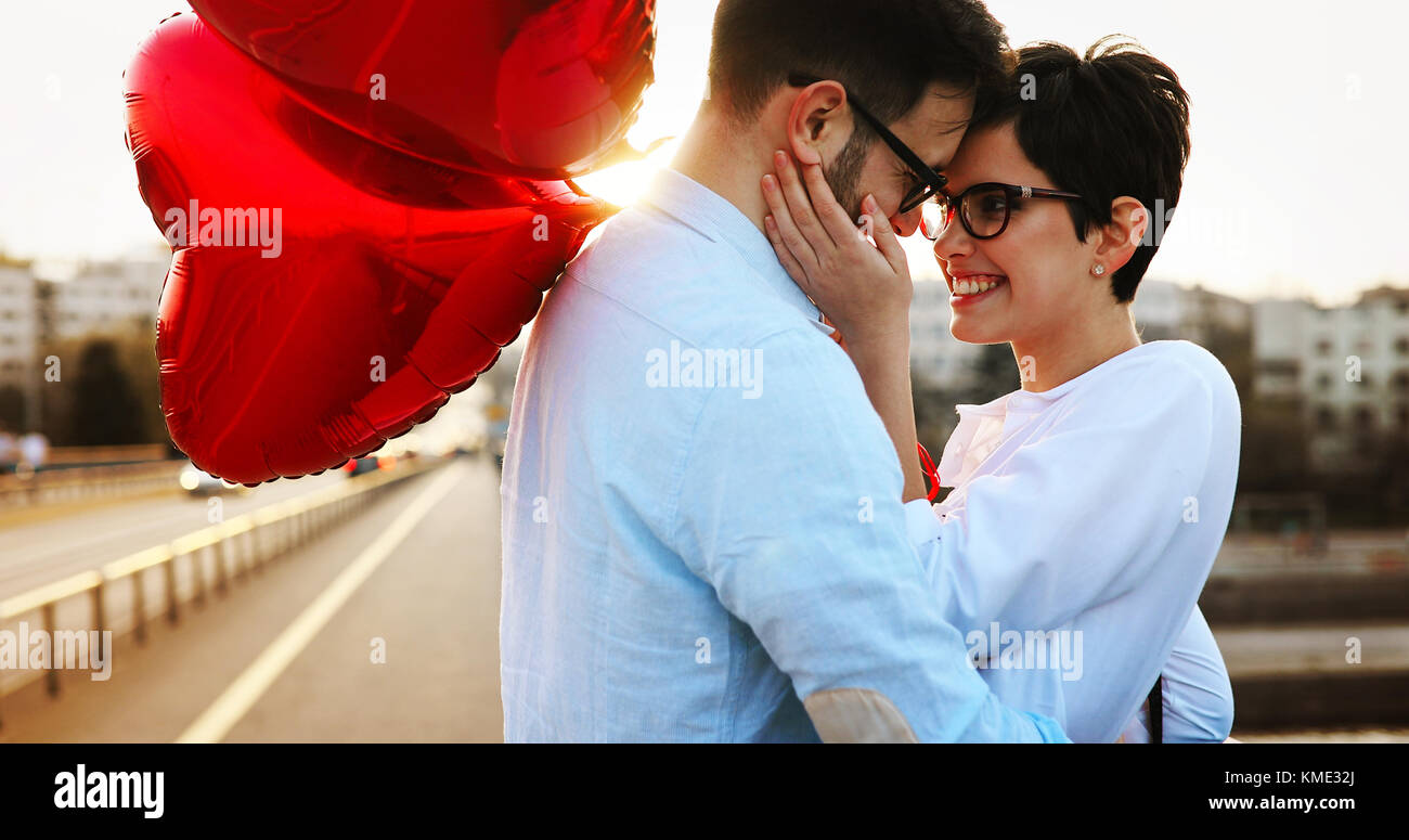 smiling couple in love with balloons on sunset Stock Photo - Alamy