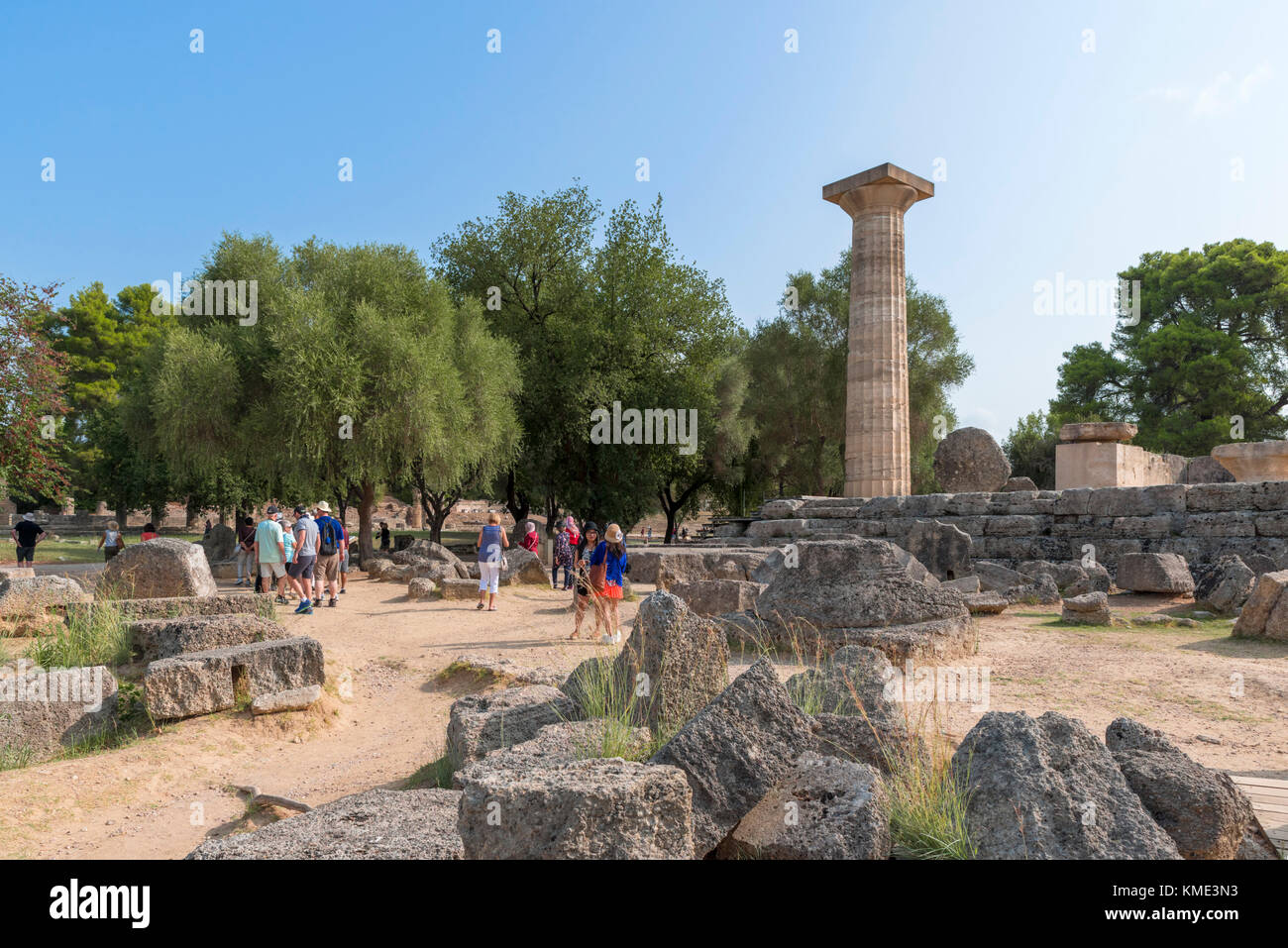 Group of tourists at the Temple of Zeus, Ancient Olympia, Pelopponese, Greece Stock Photo