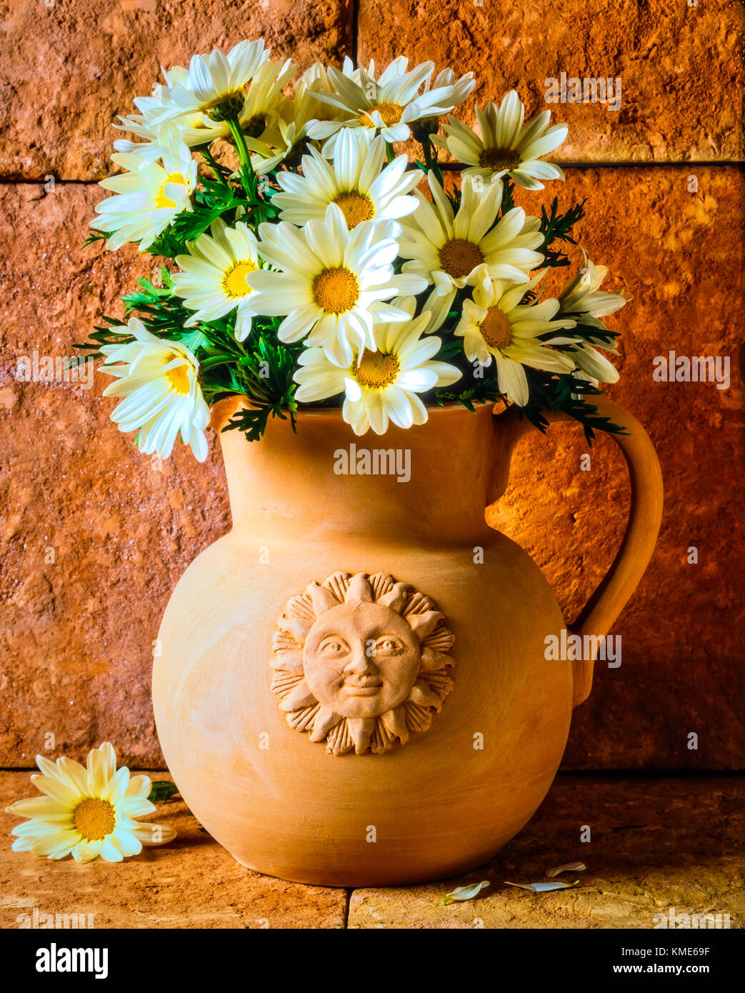 Clay Pitcher With Daises Stock Photo