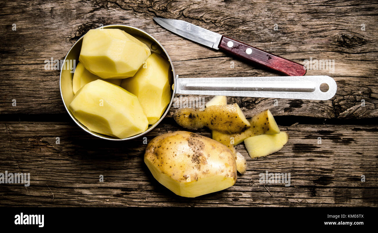 Potato Food Peeled Potatoes In An Old Pan With Knife On Wooden Table 